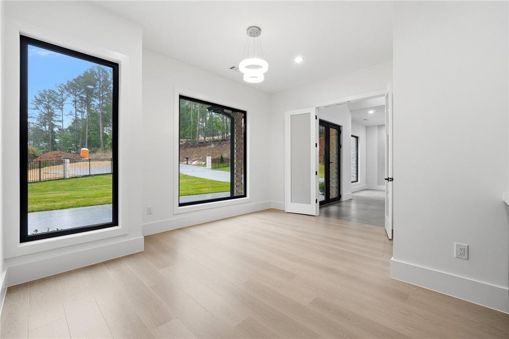 1563 Whitley Road Dacula, GA 30019 - Photo 27 of 44 an empty room with windows and entrance