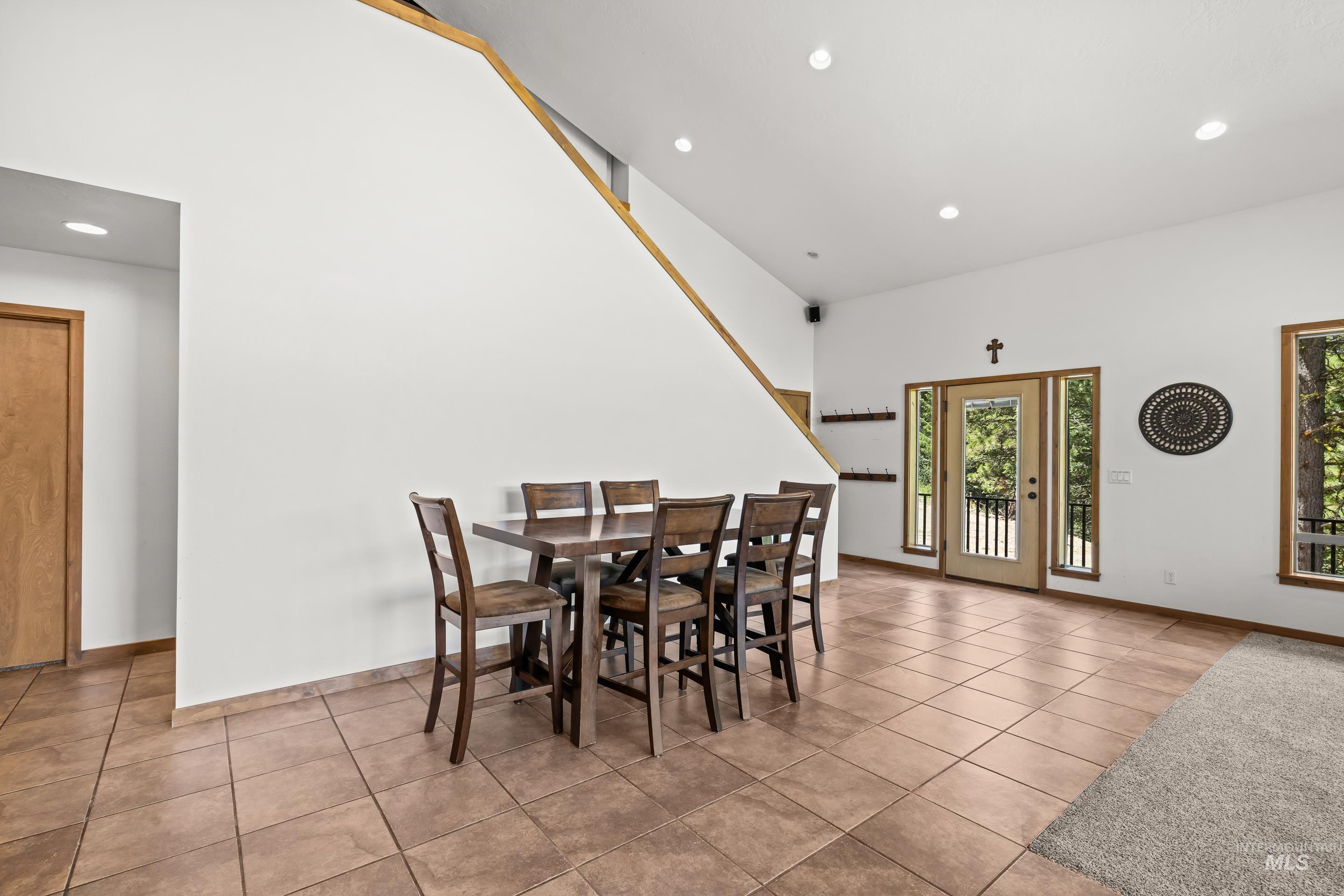92 Cruickshank Road Horseshoe Bend, ID 83629 - Photo 15 of 50 Open concept living area featuring a light wood staircase with a white riser and recessed lighting