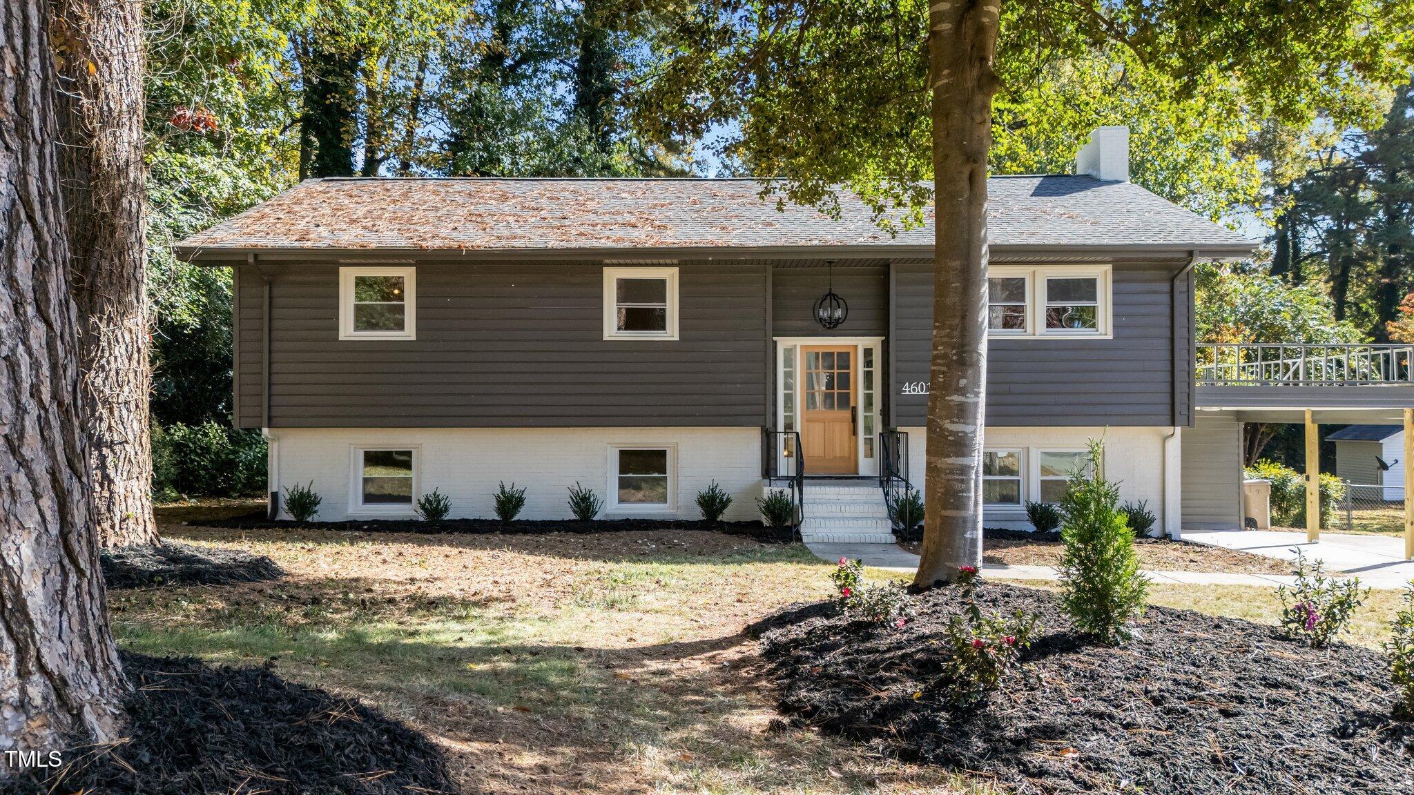 4601 Forestdale Road Raleigh, NC 27603 - Photo 1 of 46 a front view of a house with a yard