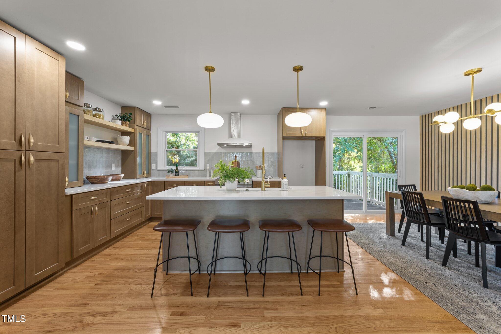 4601 Forestdale Road Raleigh, NC 27603 - Photo 12 of 46 a kitchen with a table and chairs in it