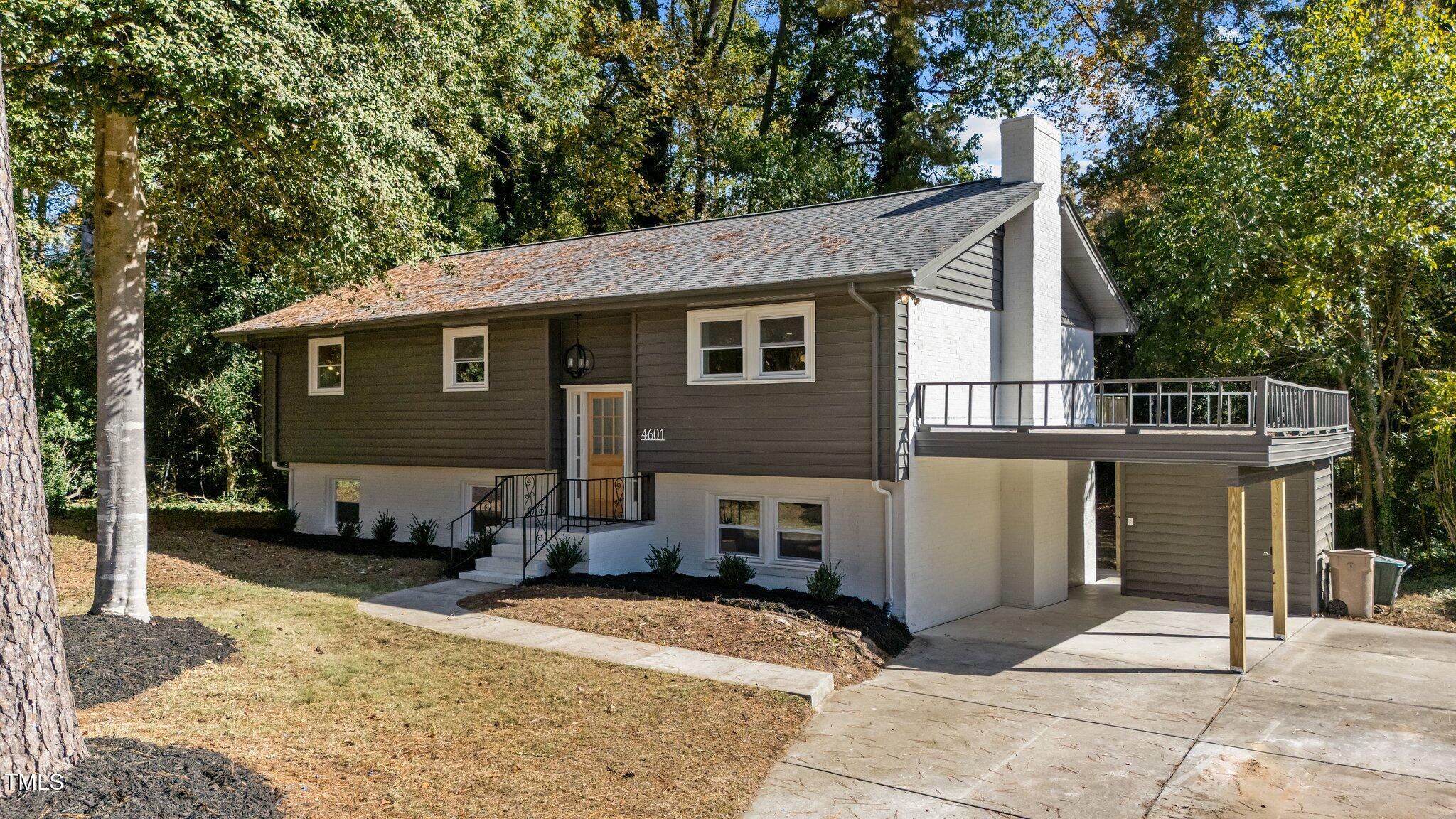 4601 Forestdale Road Raleigh, NC 27603 - Photo 2 of 46 a front view of a house with a patio