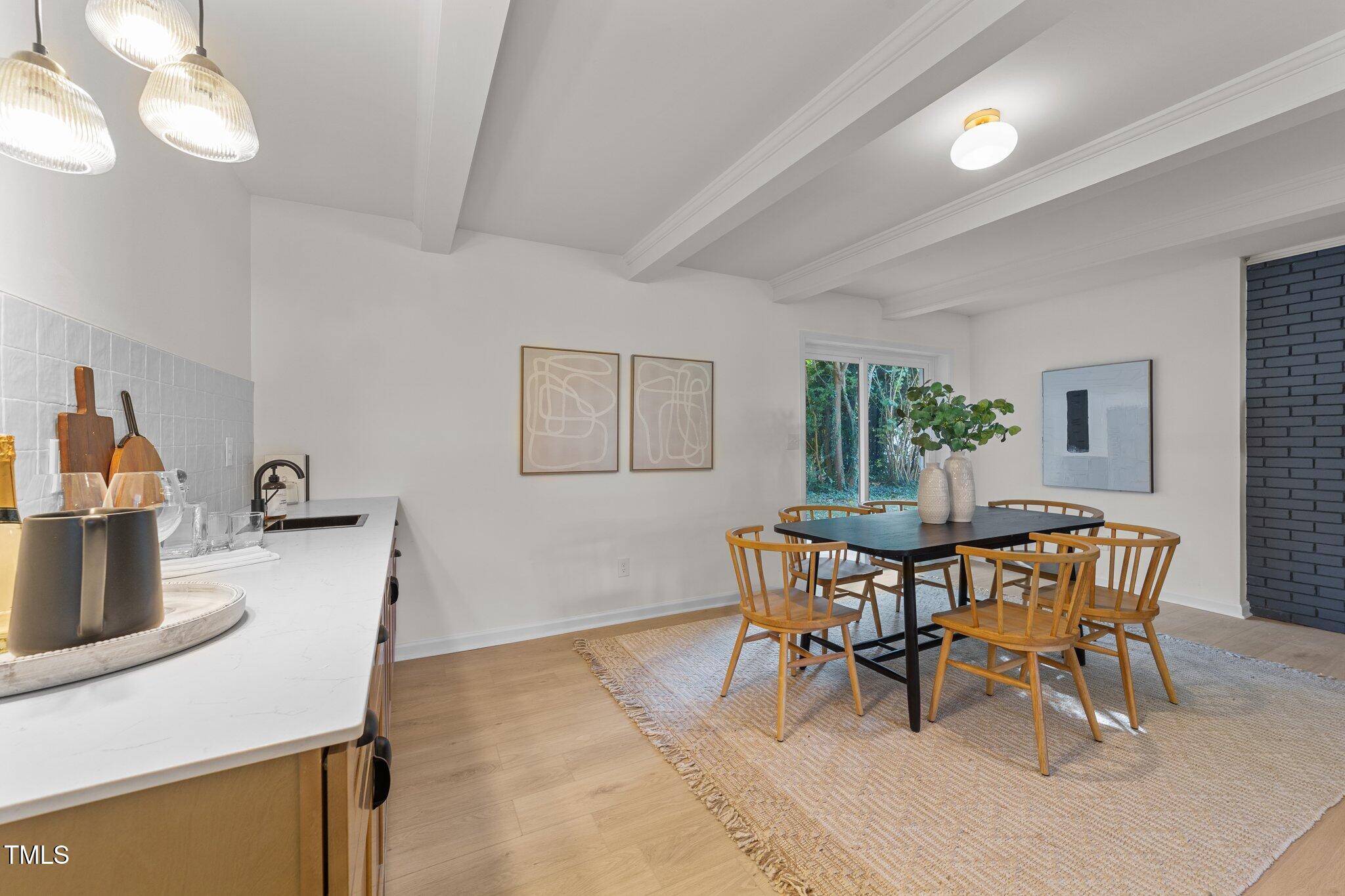 4601 Forestdale Road Raleigh, NC 27603 - Photo 29 of 46 a view of a dining room with furniture and wooden floor