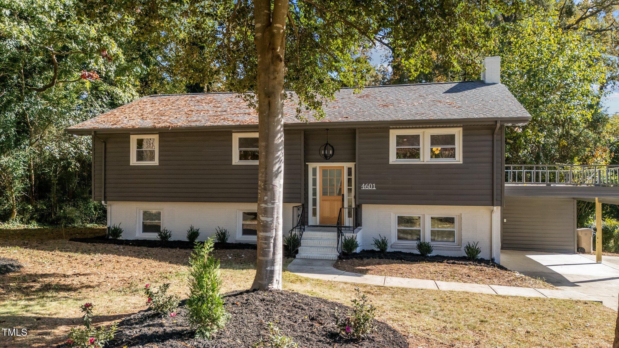 4601 Forestdale Road Raleigh, NC 27603 - Photo 3 of 46 a front view of a house with a yard