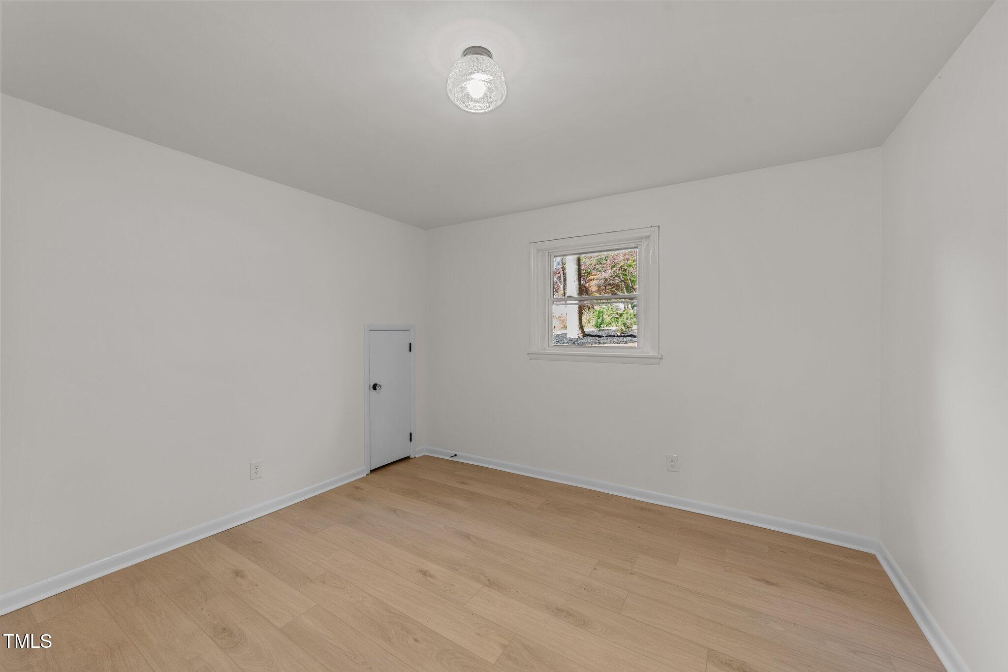 4601 Forestdale Road Raleigh, NC 27603 - Photo 31 of 46 an empty room with a window