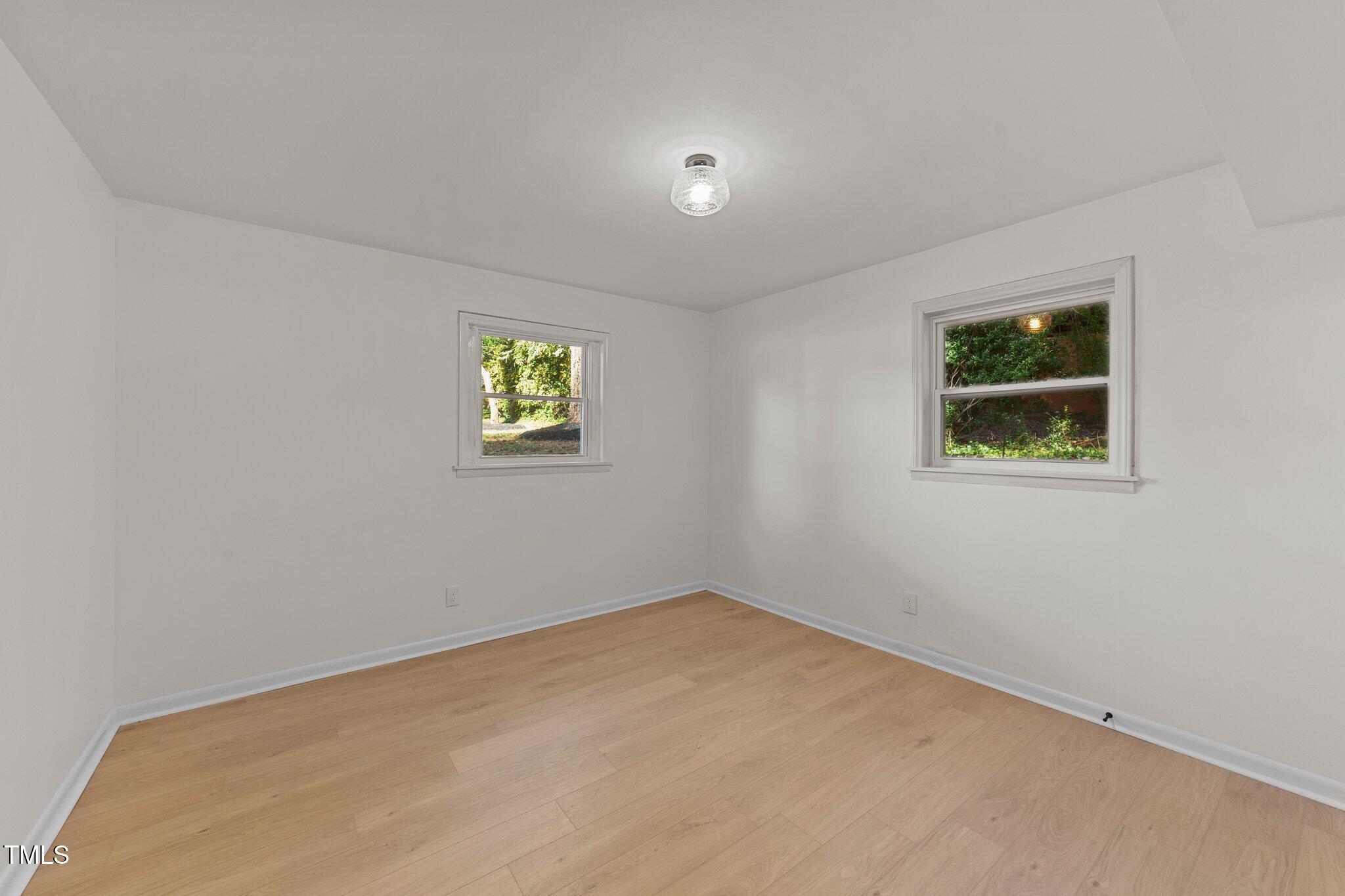 4601 Forestdale Road Raleigh, NC 27603 - Photo 33 of 46 an empty room with windows
