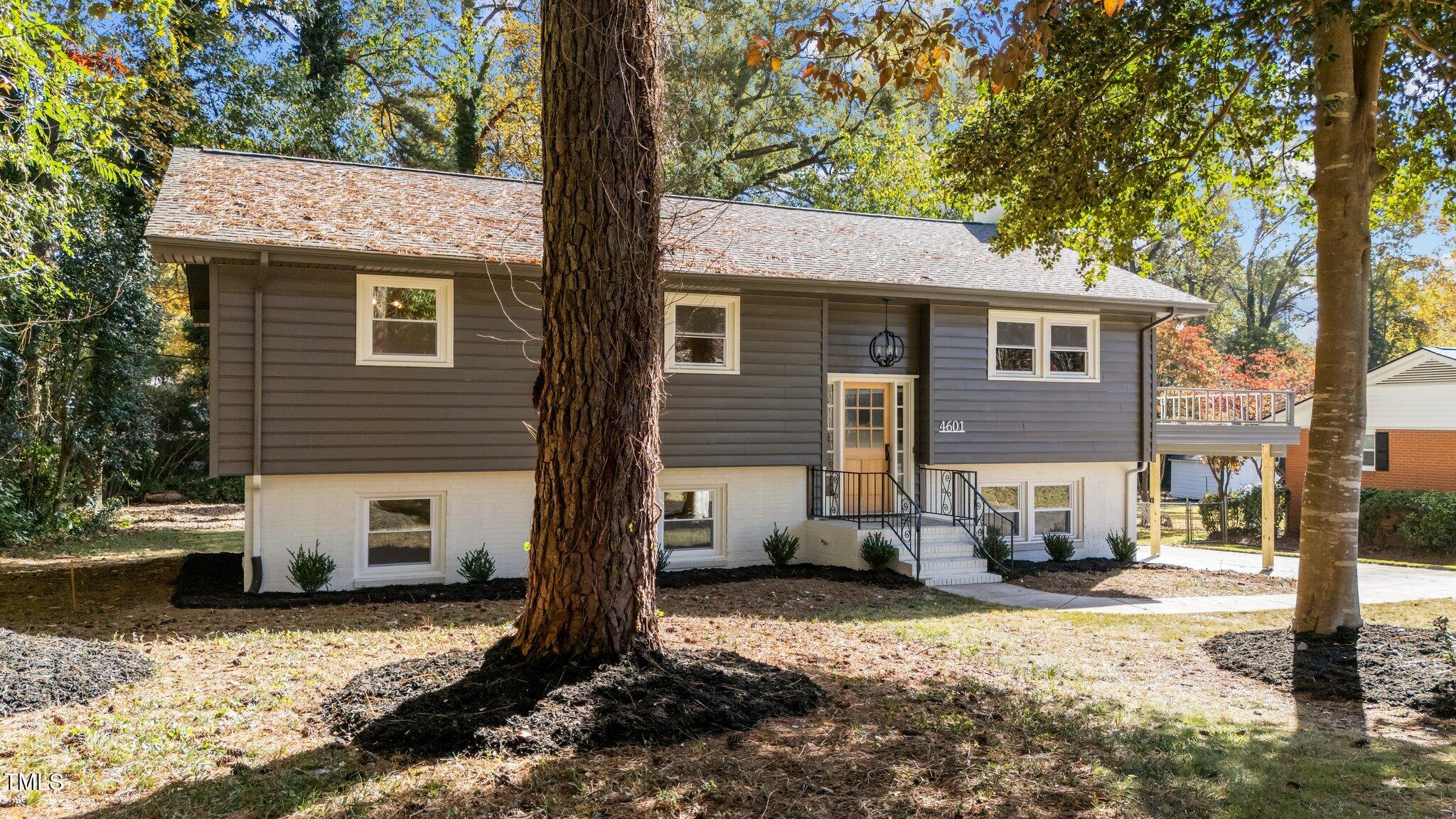 4601 Forestdale Road Raleigh, NC 27603 - Photo 4 of 46 a view of a house with a yard