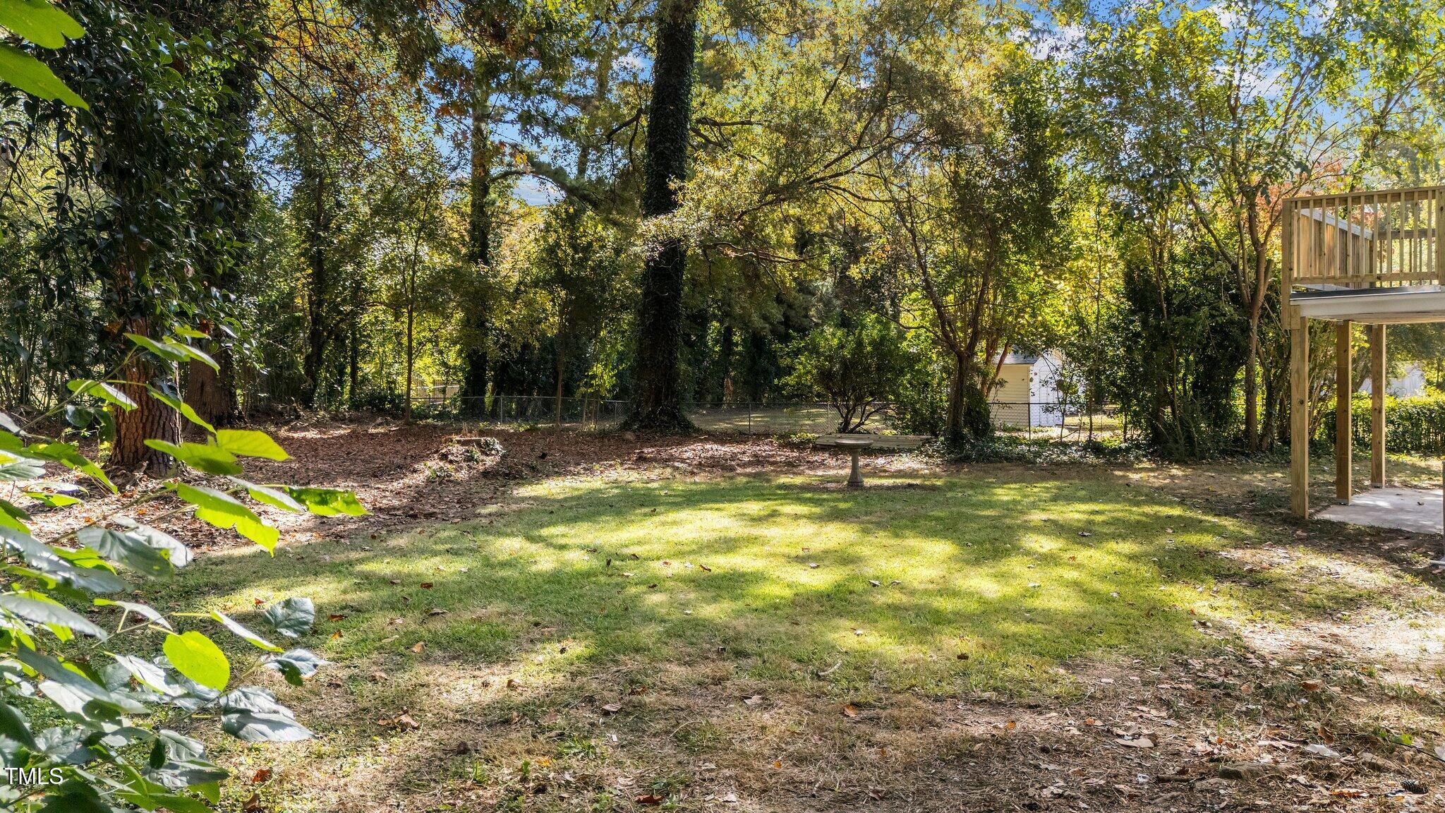 4601 Forestdale Road Raleigh, NC 27603 - Photo 41 of 46 a view of outdoor space with deck and tree