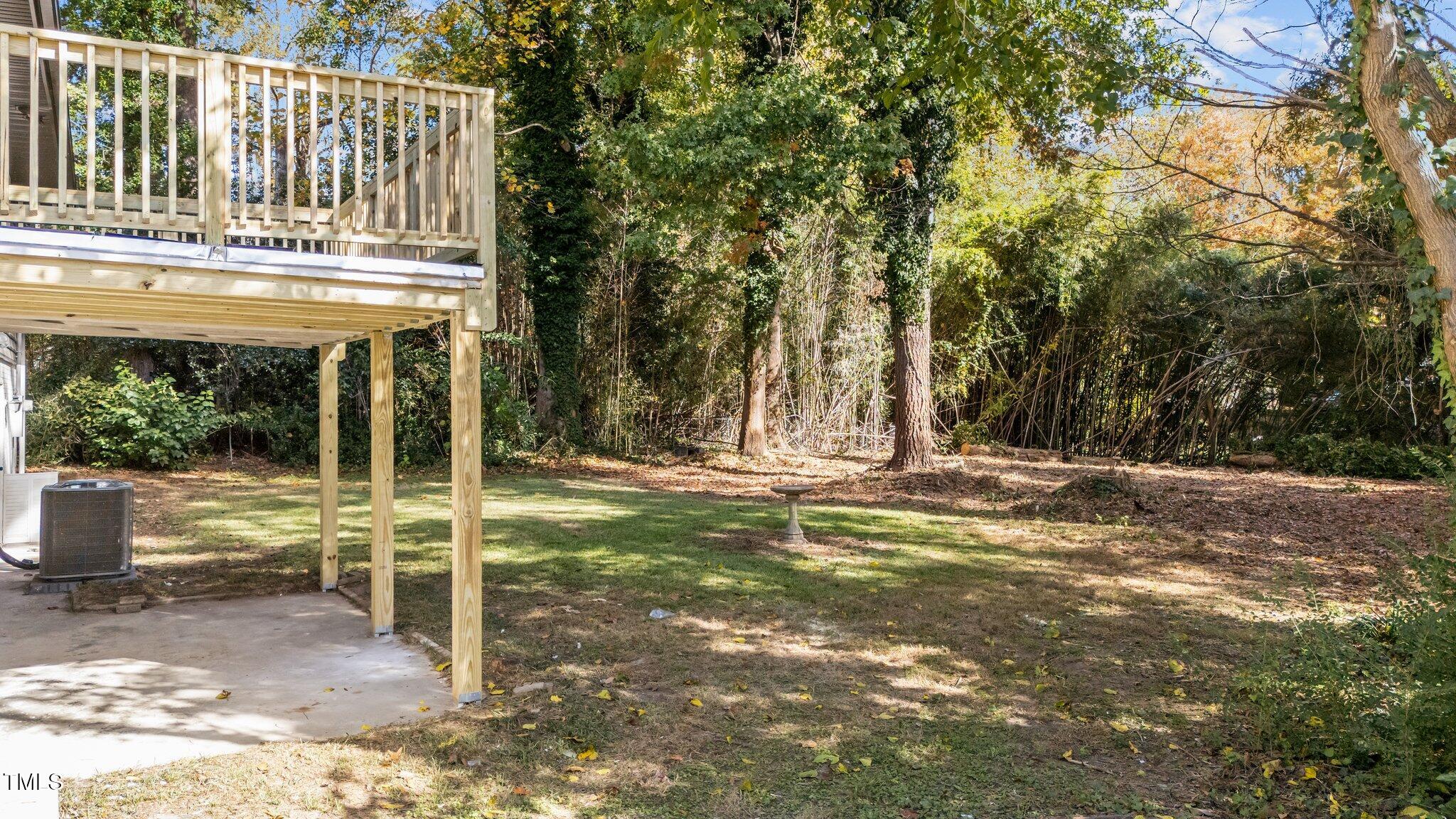 4601 Forestdale Road Raleigh, NC 27603 - Photo 43 of 46 a view of fountain in front of a yard with plants