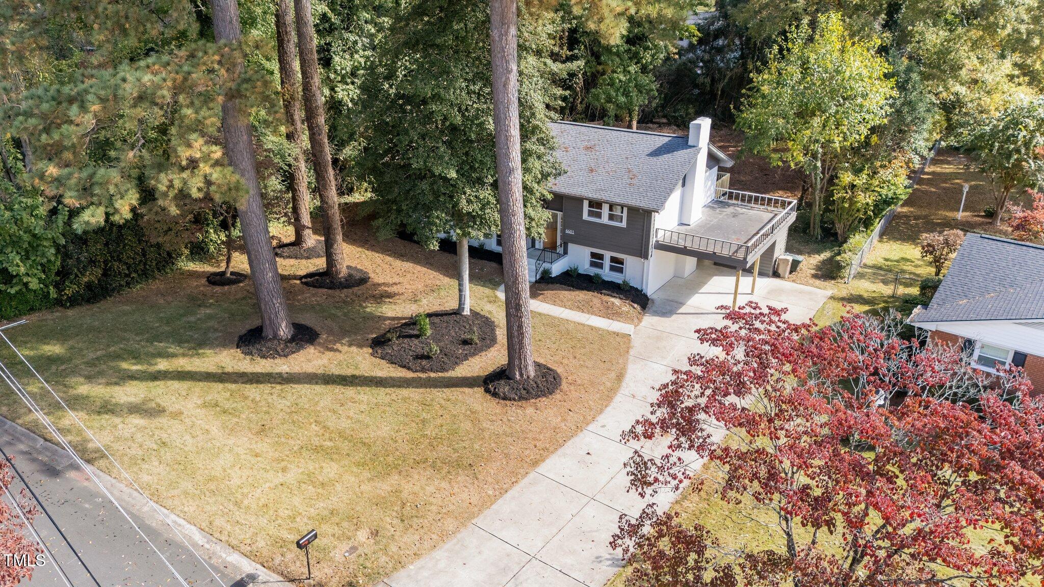 4601 Forestdale Road Raleigh, NC 27603 - Photo 44 of 46 a view of a house with yard and sitting area