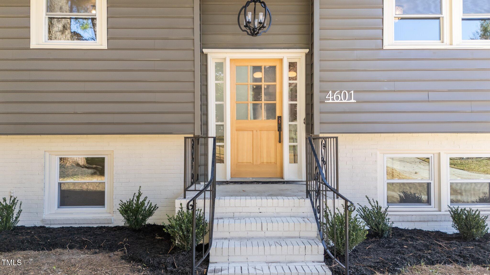 4601 Forestdale Road Raleigh, NC 27603 - Photo 6 of 46 a front view of a house with a porch