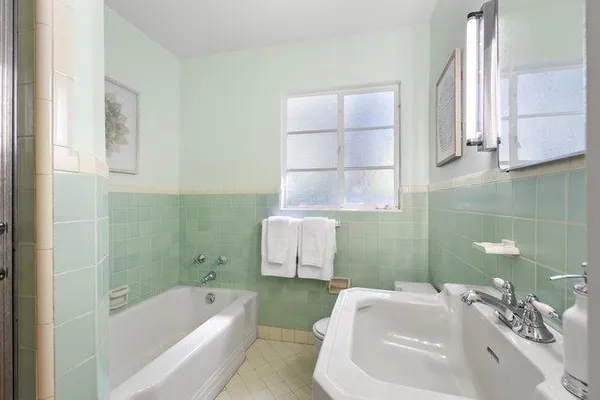 a bathroom with a sink toilet and bathtub