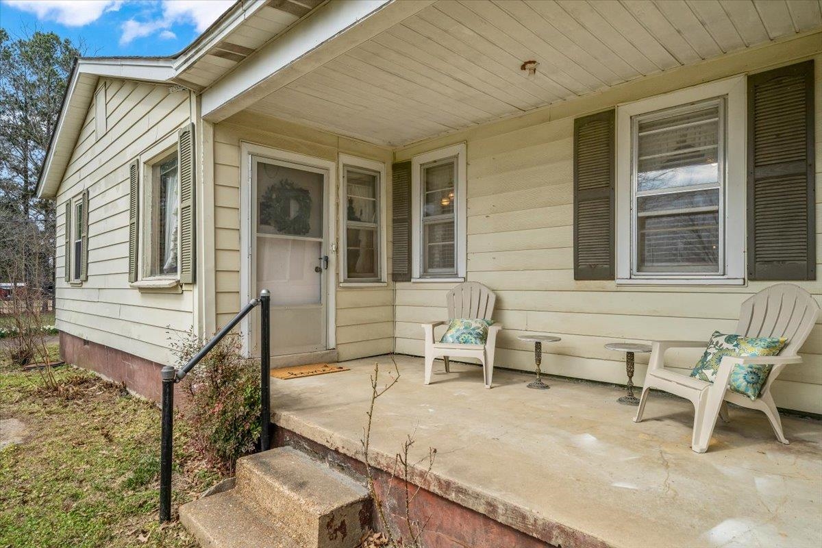 Entrance to property with a porch