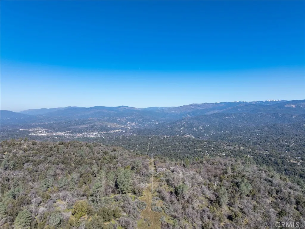 0 N/a Coarsegold, CA 93614 - Photo 11 of 19 a view of a dry yard with mountains in the background