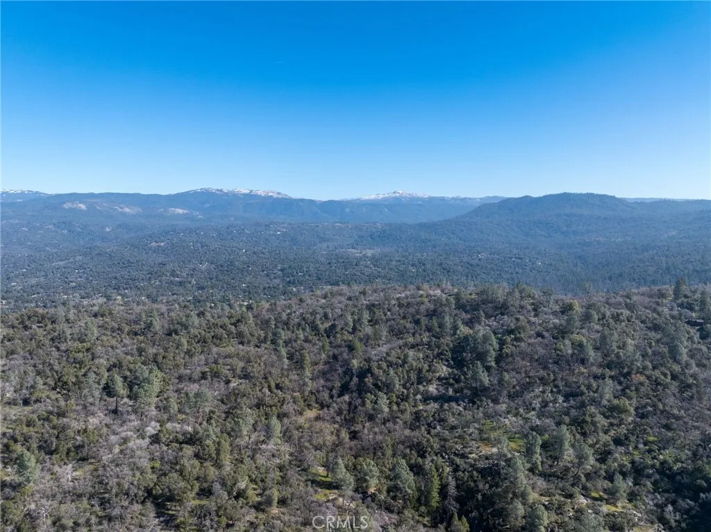 0 N/a Coarsegold, CA 93614 - Photo 15 of 19 a view of a dry yard with mountains in the background