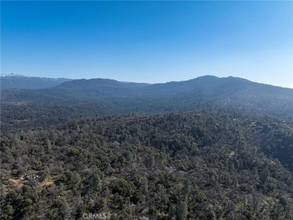 0 N/a Coarsegold, CA 93614 - Photo 4 of 19 a view of a mountain range with a lush green forest