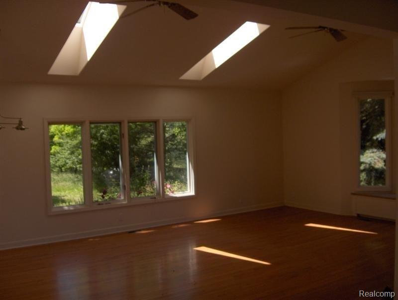 1700 North Hughes Road Howell, MI 48843 - Photo 4 of 6 Vaulted Family Room