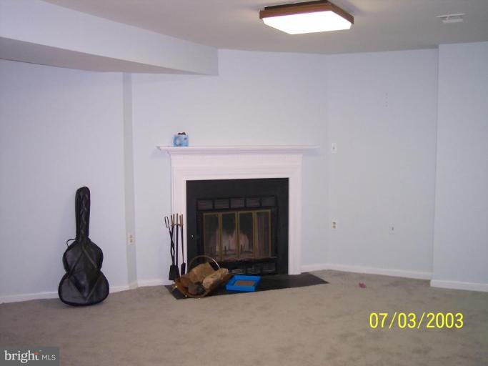 8532 Bauer Drive Springfield, VA 22152 - Photo 11 of 12 a living room with furniture and a fireplace