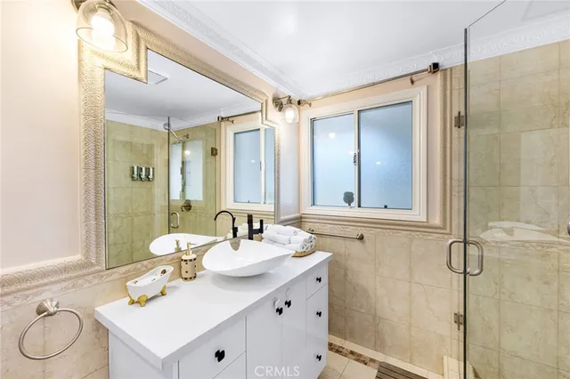 a bathroom with a double vanity sink mirror and double