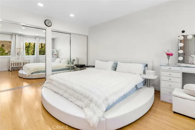 a large white bed in a white room
