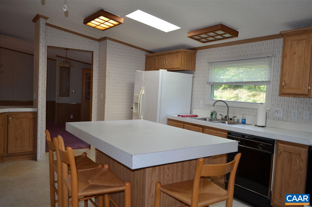 74 Begonia Road Ruckersville, VA 22968 - Photo 7 of 17 a kitchen with a table and chairs in it