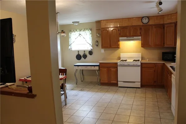 a kitchen with a sink cabinets and appliances