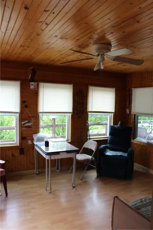 a living room with furniture a window and a table