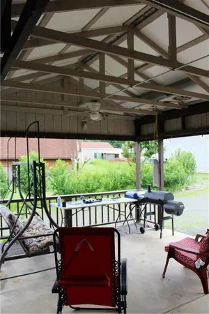 a view of a chairs and tables in the patio