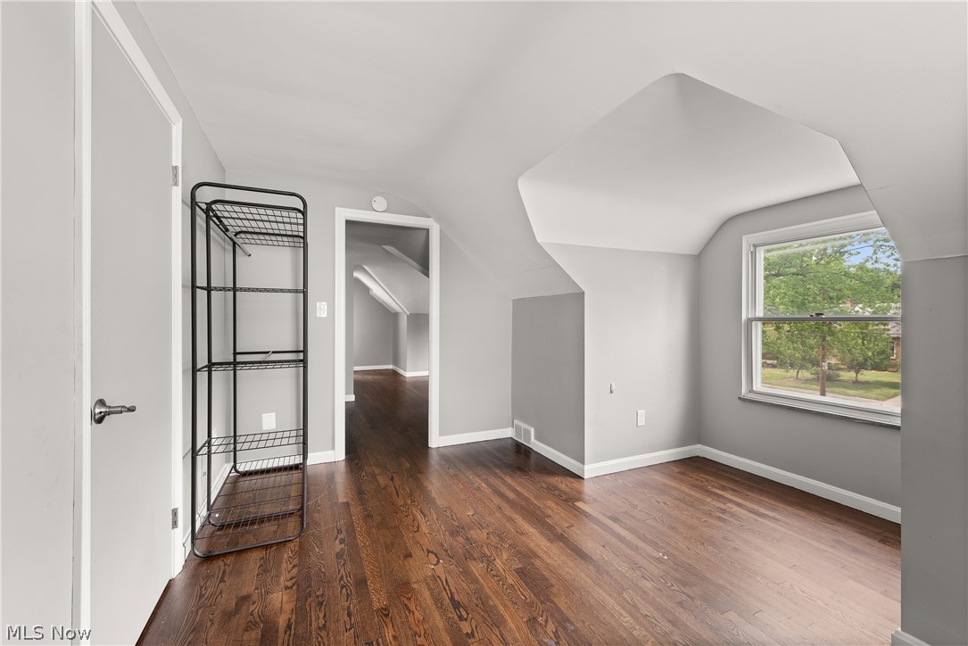 21779 Eaton Road Cleveland, OH 44126 - Photo 23 of 46 Additional living space with lofted ceiling and dark hardwood / wood-style flooring