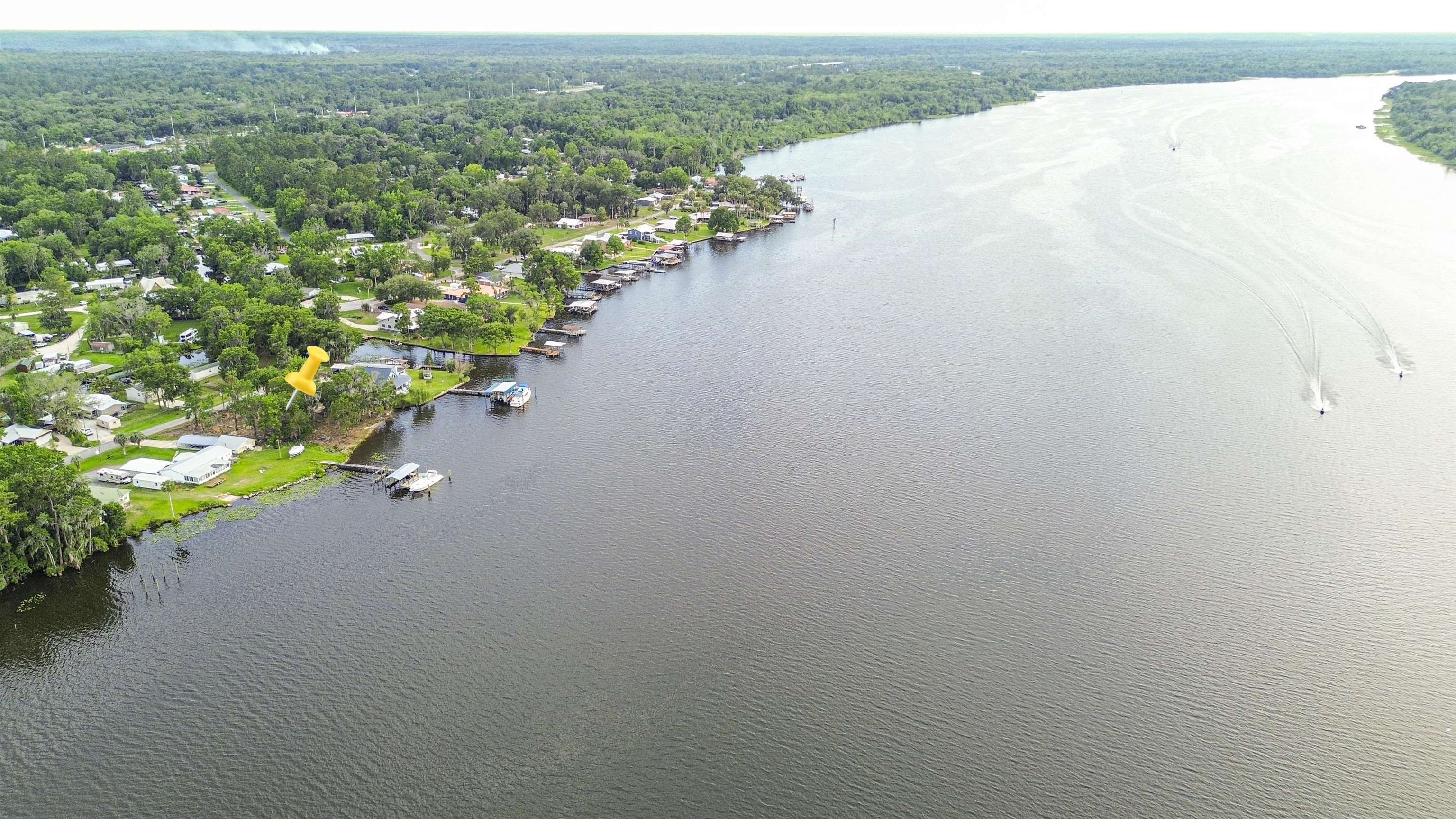 156 Rivershore Drive San Mateo, FL 32187 - Photo 9 of 9 a view of a lake with a mountain
