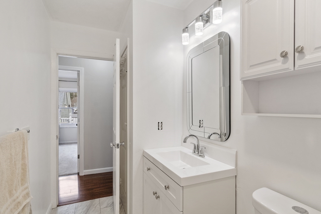53 Laurel Hill Road Southbridge, MA 01550 - Photo 13 of 28 a bathroom with a toilet sink and mirror