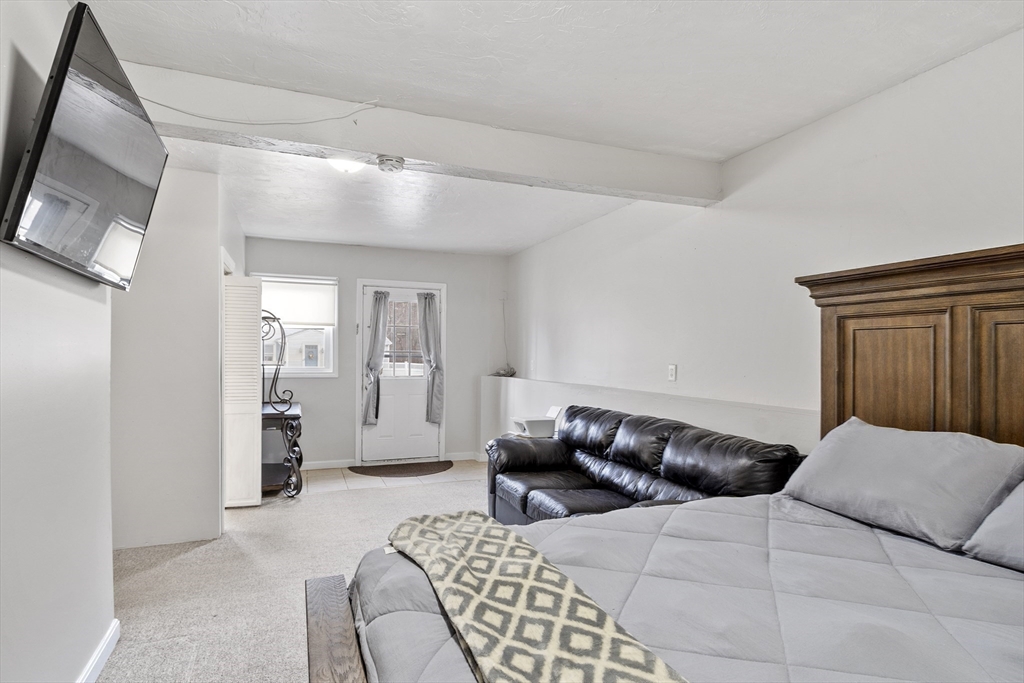 53 Laurel Hill Road Southbridge, MA 01550 - Photo 15 of 28 a bedroom with a bed and a mirror