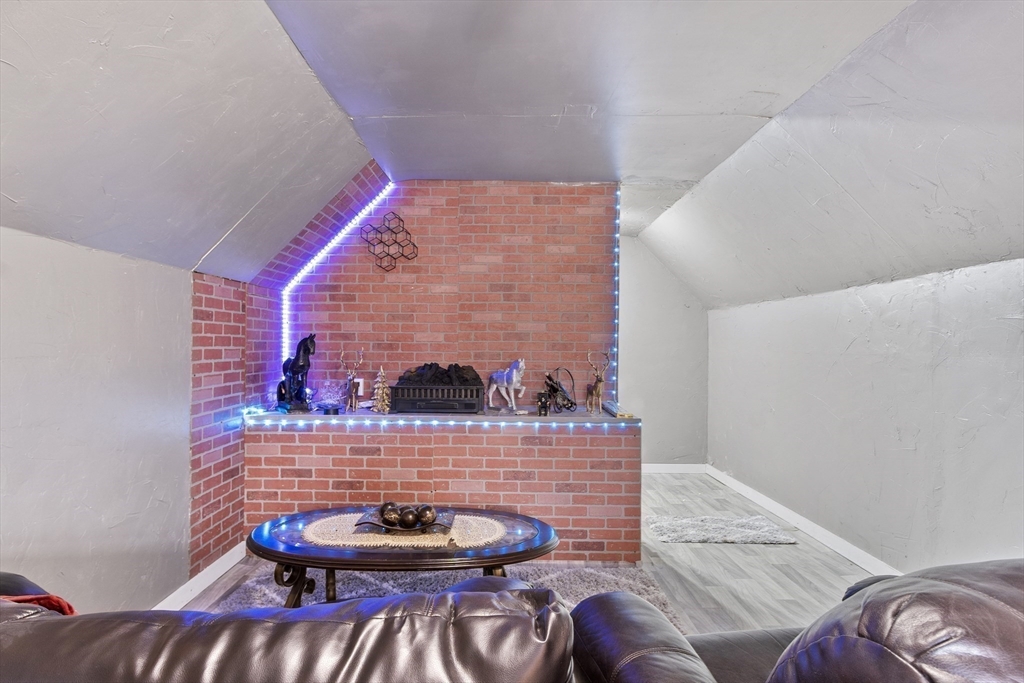 53 Laurel Hill Road Southbridge, MA 01550 - Photo 20 of 28 a living room with furniture and a wooden floor