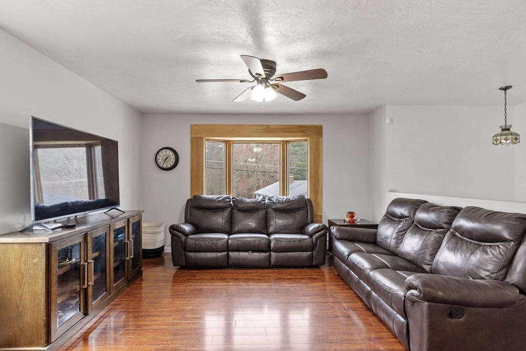 53 Laurel Hill Road Southbridge, MA 01550 - Photo 3 of 28 a living room with furniture and a flat screen tv