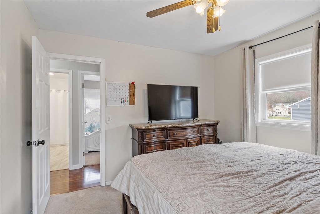 53 Laurel Hill Road Southbridge, MA 01550 - Photo 8 of 28 a bedroom with a bed and a flat screen tv