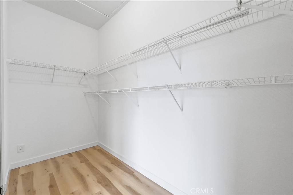 7522 Calais Court Rancho Cucamonga, CA 91730 - Photo 13 of 20 a view of a room with racks on the wall