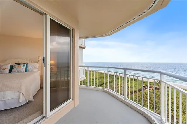 a view of balcony with wooden floor