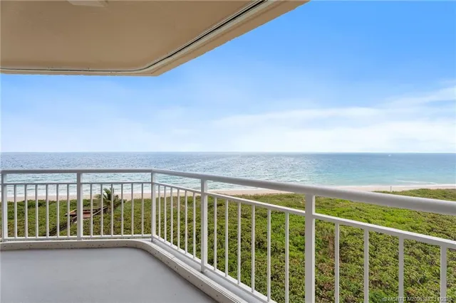 a view of balcony with furniture