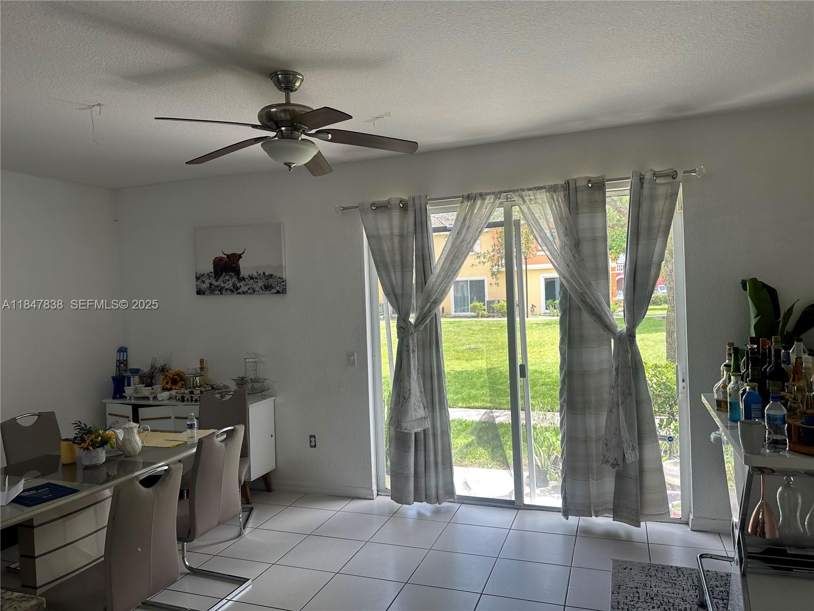 8922 Southwest 18th Street, Unit 8922 Miramar, FL 33025 - Photo 16 of 22 a kitchen with stainless steel appliances granite countertop a sink a stove and a refrigerator