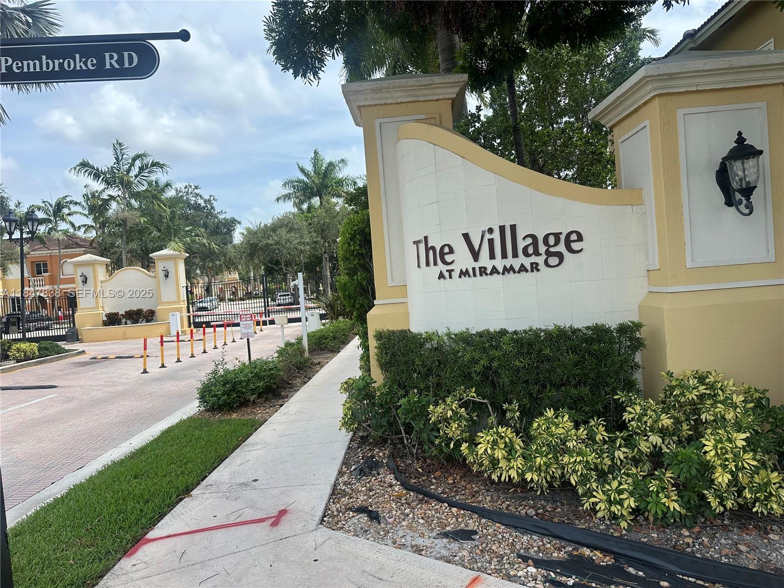 8922 Southwest 18th Street, Unit 8922 Miramar, FL 33025 - Photo 4 of 22 a sign broad on the side of the road