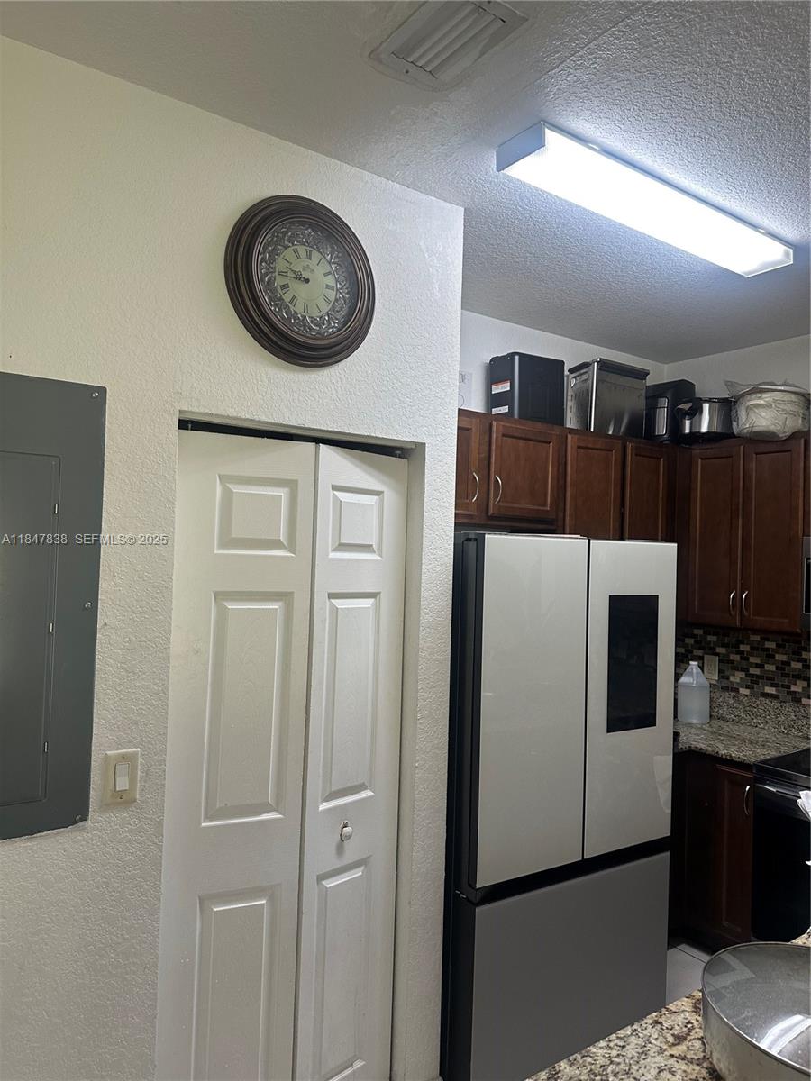 8922 Southwest 18th Street, Unit 8922 Miramar, FL 33025 - Photo 10 of 22 a view of a refrigerator a washer and dryer