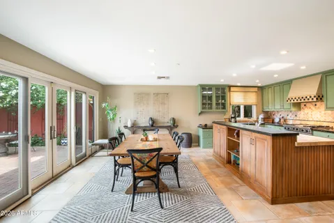 a living room with fireplace furniture and a book shelf