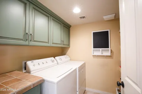 a kitchen with a refrigerator and a sink