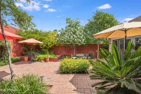 a bedroom with a bed and a table with chair