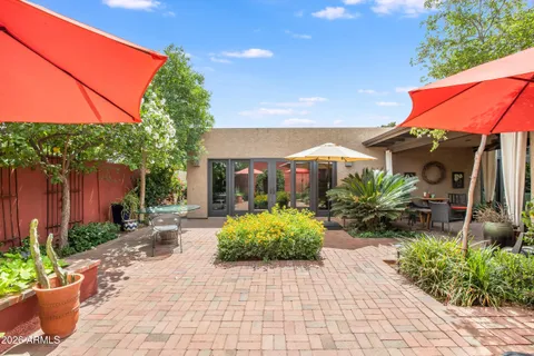 a view of a backyard with potted plants