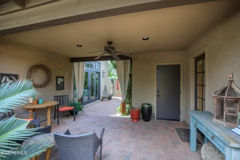 a view of a backyard with sitting area