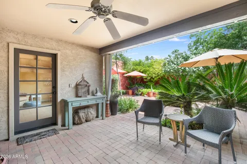 a living room with furniture and a potted plant