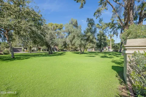 a view of a livingroom with workspace and a window