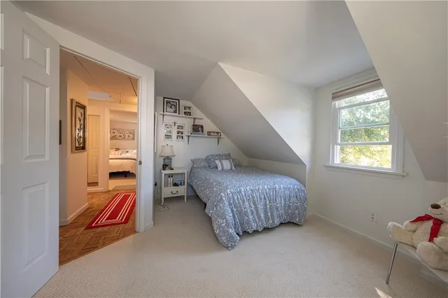 a living room with furniture and a lamp