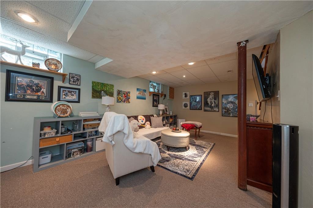 67 Ridge Road Pittsburgh, PA 15221 - Photo 19 of 37 a living room with furniture and a flat screen tv
