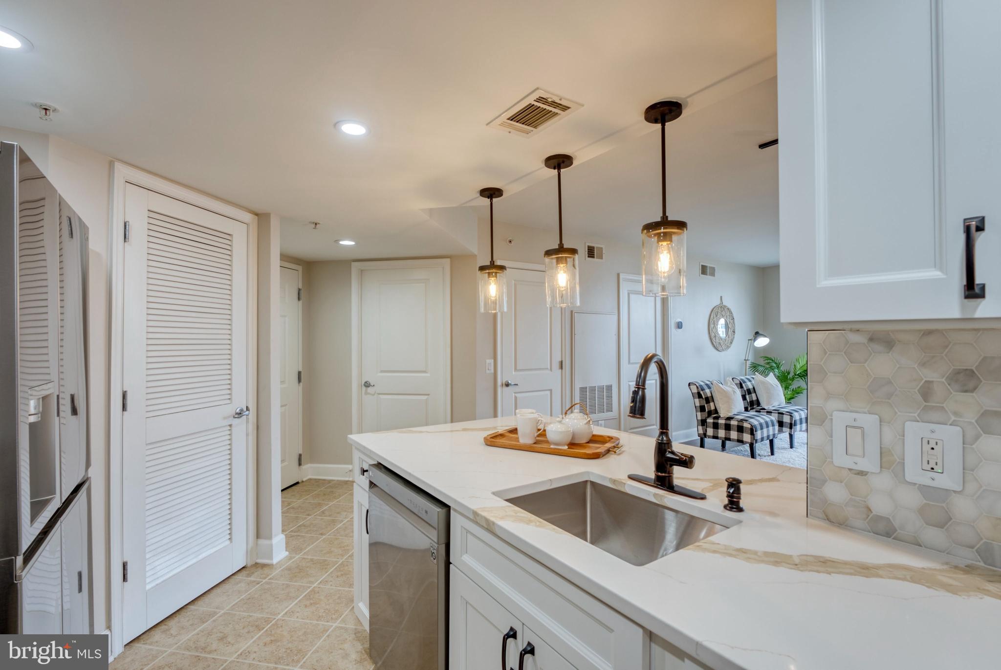 11800 Sunset Hills Road, Unit 913 Reston, VA 20190 - Photo 11 of 52 Opened up kitchen counter- removed wall